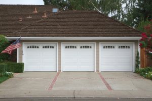 Triple garage doors on a suburban home