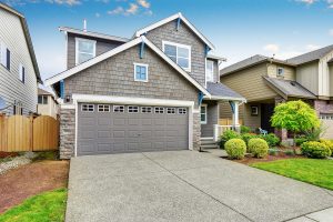 Modern gray house with single garage door